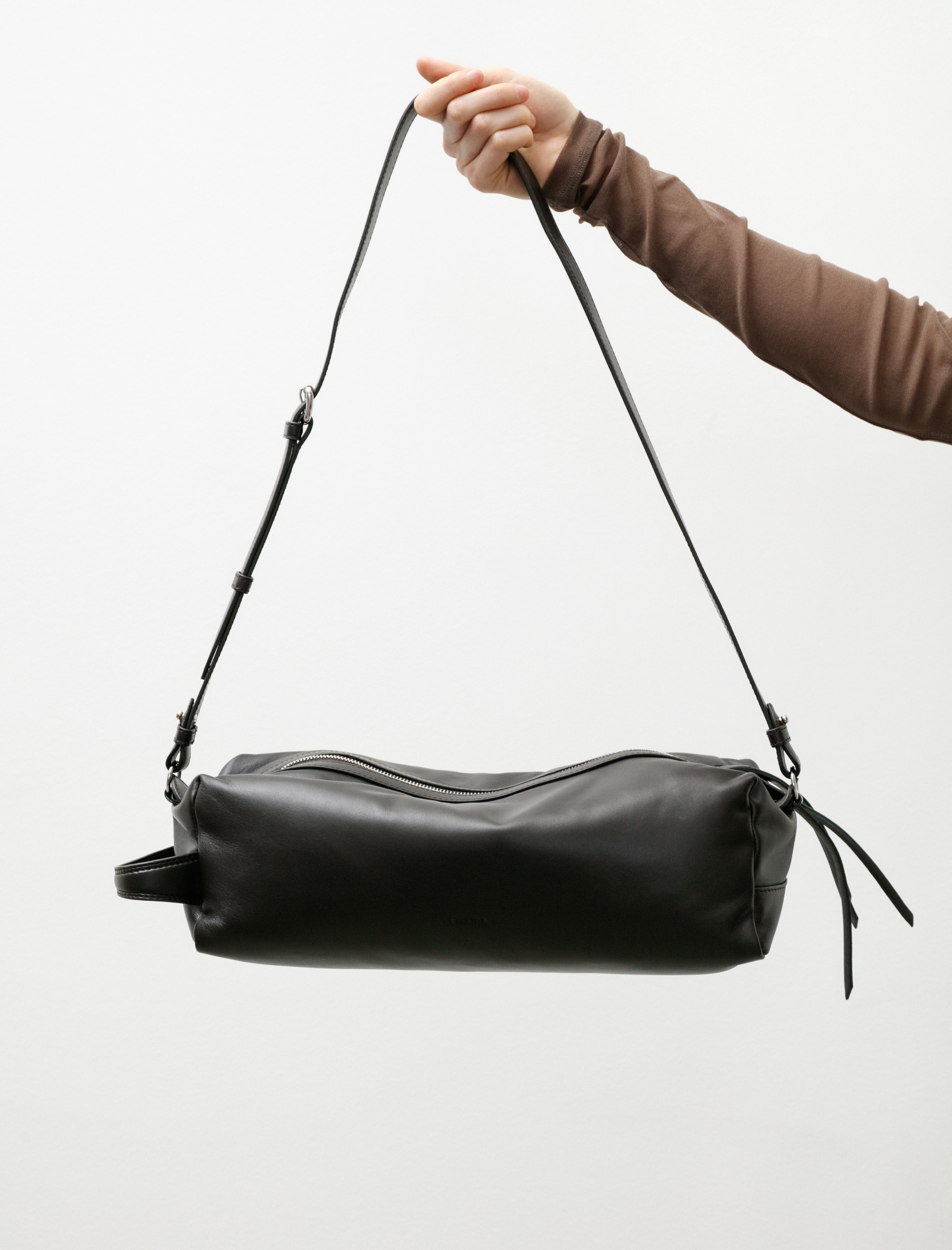 Lemaire The Care Slingbag Dark Chocolate
